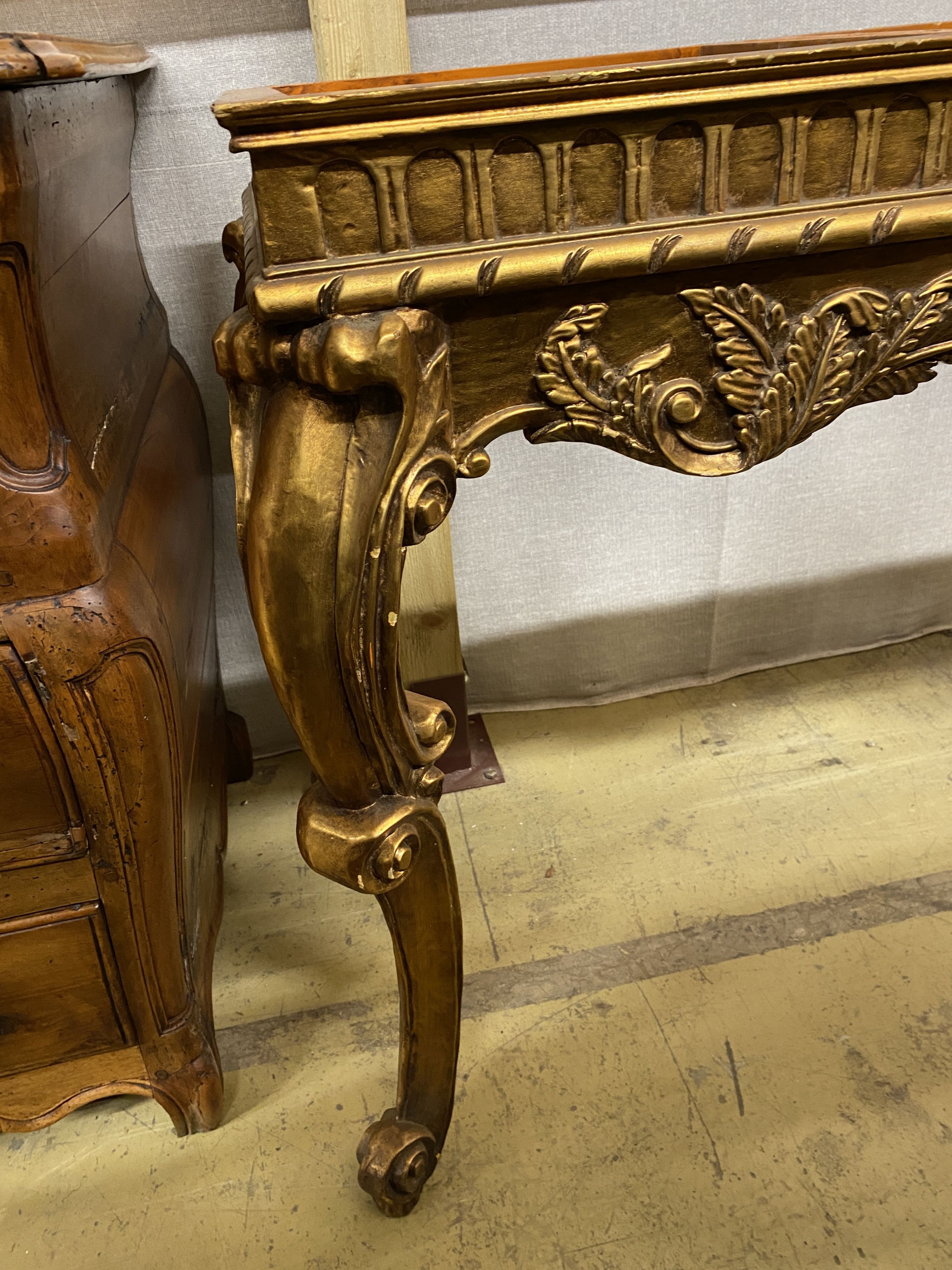Two 18th century style giltwood table bases (lacking marble tops), larger width 127cm, depth 47cm, height 79cm